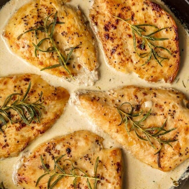 This CREAMY WHITE WINE DIJON CHICKEN with rosemary is sure to make the weekly rotation on your dinner menu. Utterly delicious, easy, and sure to please.