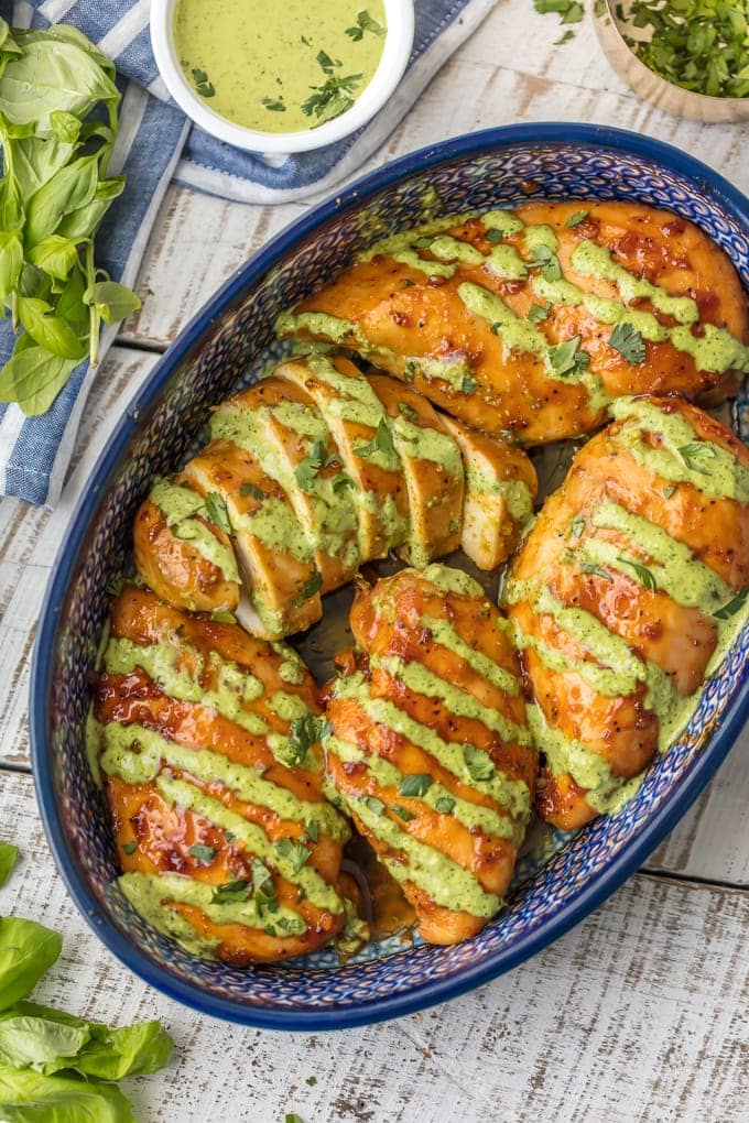 Peruvian Chicken in baking dish with Peruvian Green sauce