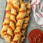 This PIZZA ON A STICK is always a hit with both kids and adults. We made ours pepperoni, but you can do any flavor combination! So fun and EASY!