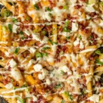 Nothing makes game day delicious more than 3 CHEESE BACON RANCH FRIES. This easy and fun appetizer takes crispy fries and tops them with ranch seasoning, bacon, cheddar, mozzarella, and feta.