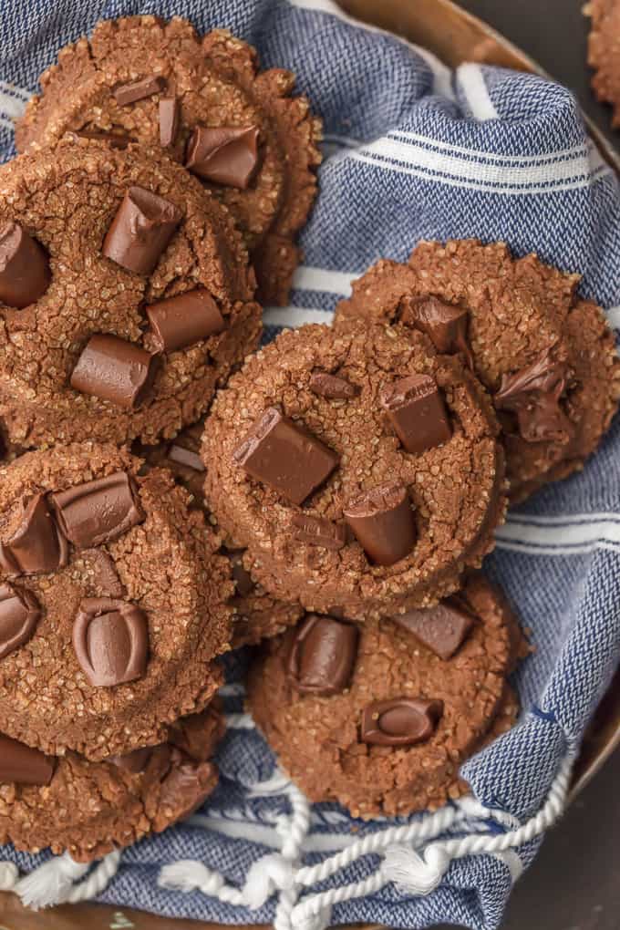 chocolate sugar cookies arranged on a blue dish towel