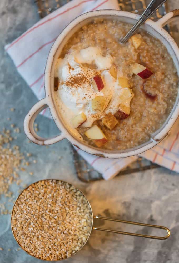 Apple Oatmeal topped with whipped cream and diced apples