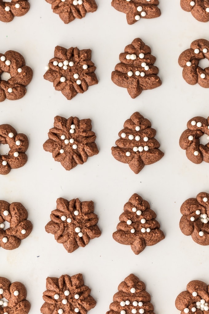 Chocolate spritz cookies in holiday shapes