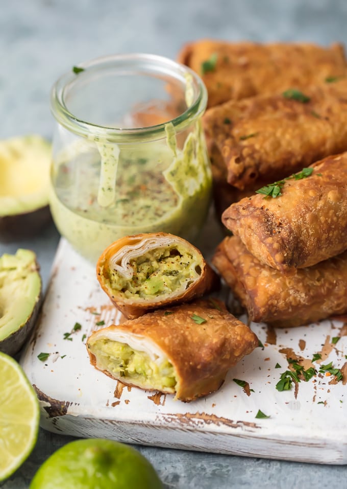 Avocado Egg Rolls on white serving board