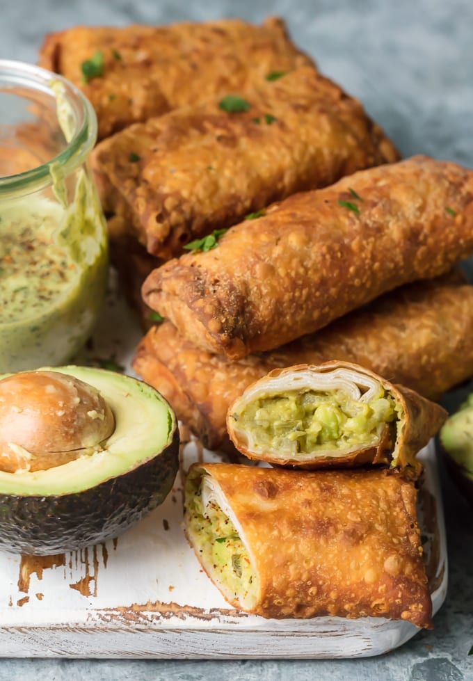 Avocado Egg Rolls and a sliced avocado