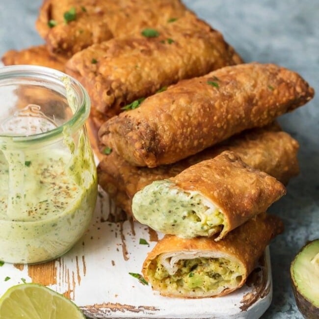 Avocado Egg Rolls on white serving board