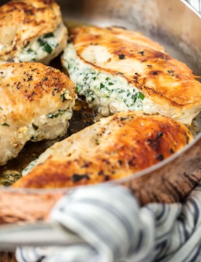 Spinach Stuffed Chicken Breast is a 3 INGREDIENT CHICKEN RECIPE that's healthy (around 400 calories), made in under 30 minutes, and done in just ONE PAN! This Spinach Stuffed Chicken Breast is one of our all-time favorite Stuffed Chicken Breast Recipes. Cheesy, delicious goodness.