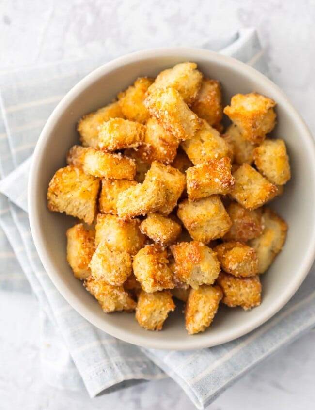 This HOMEMADE CROUTONS RECIPE is super simple.  Impress everyone including yourself with these HEALTHY BAKED CROUTONS! I love that these are BAKED and not fried, making them a healthier alternative to this classic recipe. They're the perfect way to take any salad from good to great. 