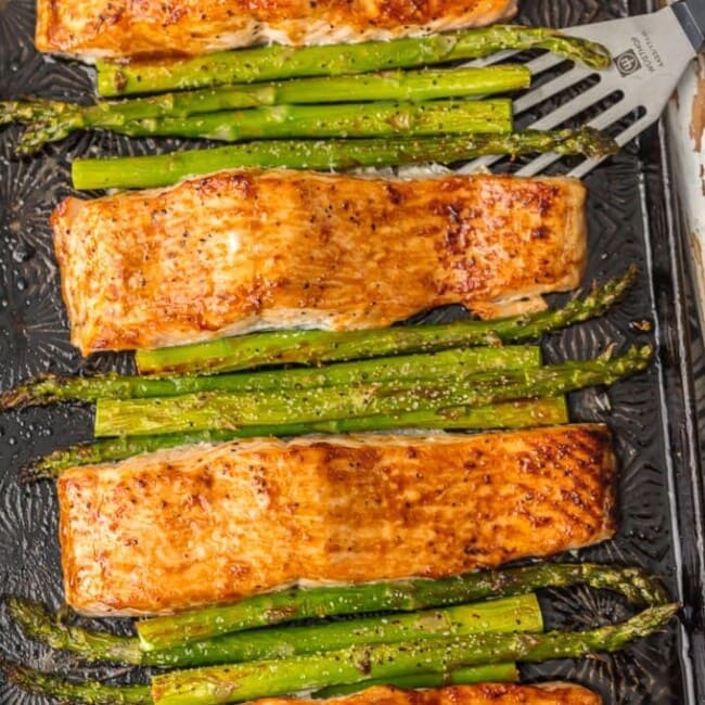 This HOISIN SALMON AND ASPARAGUS RECIPE has it all! It's a simple and healthy seafood recipe made entirely on ONE SHEET PAN. So much flavor and so little prep/cleanup. So much to love about this sheet pan glazed salmon.