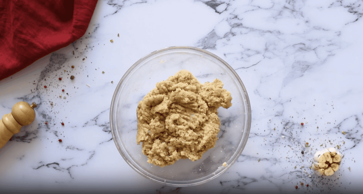 seasoned ground chicken in a glass bowl.