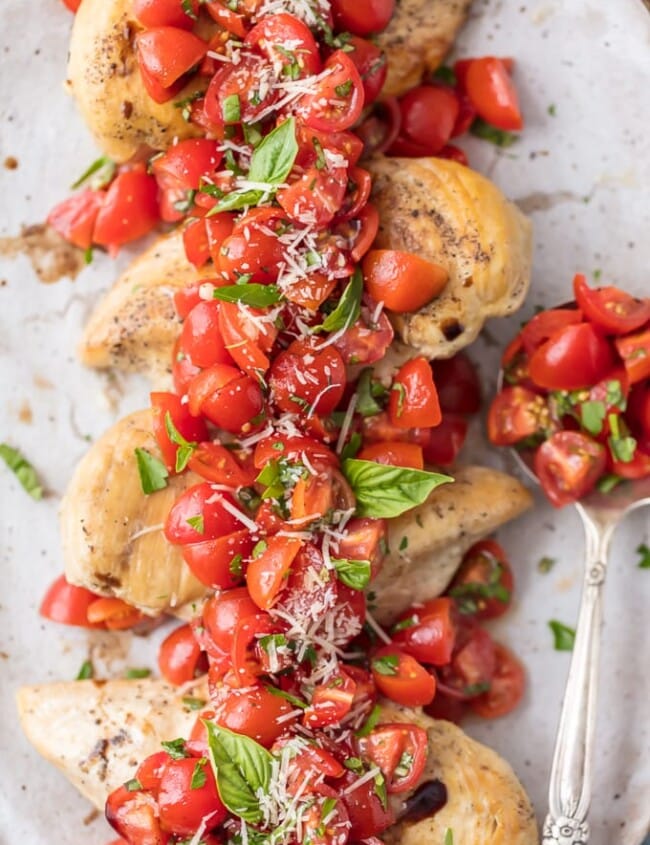 Instant Pot Chicken Bruschetta is a fresh, light, quick, and EASY Instant Pot Chicken Recipe! Bruschetta Chicken with tomatoes, basil, balsamic, and parmesan cheese has always been one of my favorite recipes, and it's only better made in an instant pot! Instant Pot Bruschetta Chicken is one of our go-to easy weeknight meals.