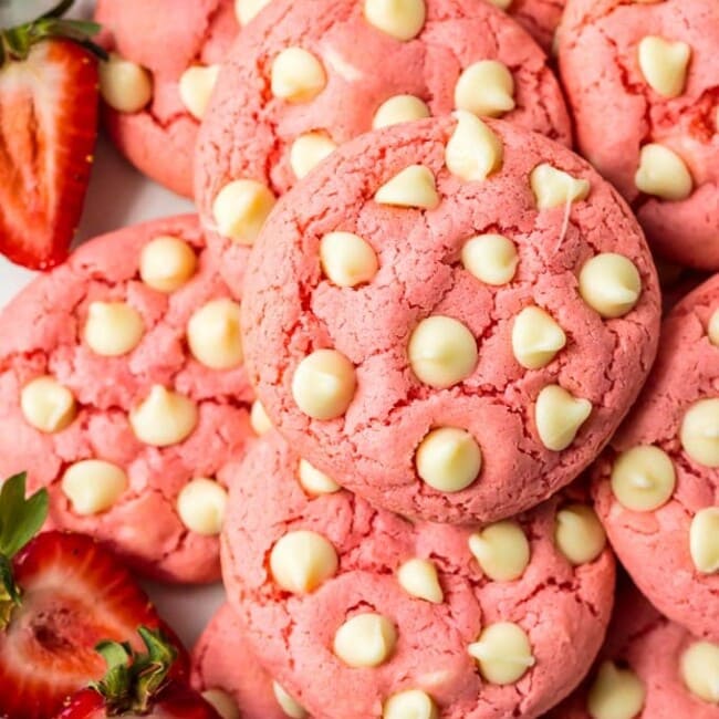 Strawberry Cookies are my favorite Strawberry Cake Mix Cookies! These White Chocolate Strawberry Cake Mix Cookies are so fun and delicious, and so super easy! Fun, festive, and SUPER SIMPLE! Strawberry Cookies with White Chocolate Chips are the perfect Pink Cookies for Valentine's Day, Easter, baby and wedding showers, and beyond! This Cake Mix Cookies Recipe will blow your mind.