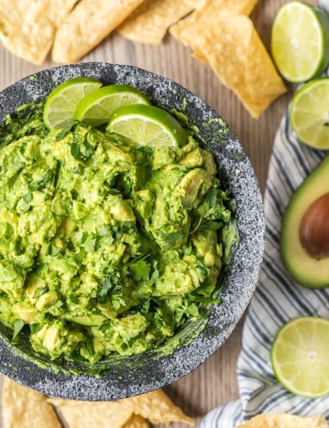 The BEST GUACAMOLE RECIPE EVER! I'm a big fan of Mexican food and dips. So of course I'm obsessed with guacamole too. I cut this Simple Guacamole Recipe down to the basics and it is so fresh. Everything blends together to create the perfect, creamy flavor. This Homemade Guacamole Recipe is my favorite dip for Mexican dinners. I could eat it alll day!