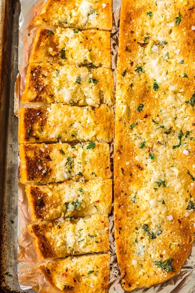 sliced garlic bread on foil