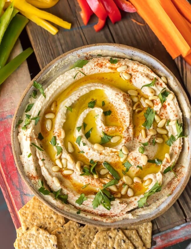 Homemade Hummus is so creamy, so flavorful, and so healthy too! This is a delicious dip you can get away with eating every single day. Learn how to make hummus with the BEST hummus recipe ever. So easy and it tastes good with just about everything!