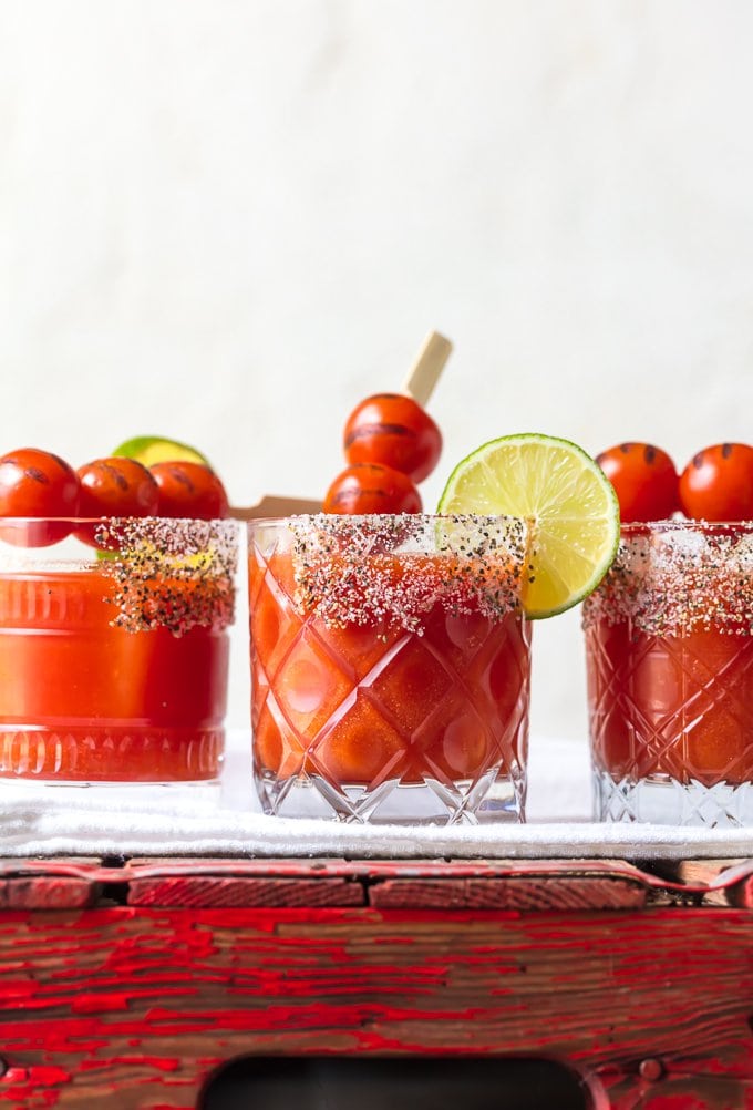 3 tomato margaritas garnished with roasted cherry tomatoes