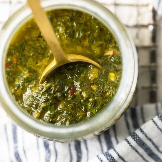 Chimichurri Sauce is a simple yet delicious sauce that is mostly used on grilled meats (Chimichurri Steak Sauce). This green Chimichurri Sauce recipe is filled with herbs and spices, with an olive oil base. It's the perfect marinade for meats, a great sauce for roasted cauliflower, or an interesting dip for all kinds of foods. Find out how to make Chimichurri Sauce for your next grilled dish!