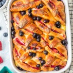 croissant french toast casserole in a white dish