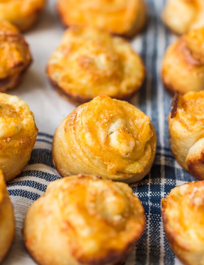 Garlic Cheese Bread Roll Ups are a fun and cheesy recipe that you can serve with any meal. These little garlic rolls are easy to make and so darn delicious!