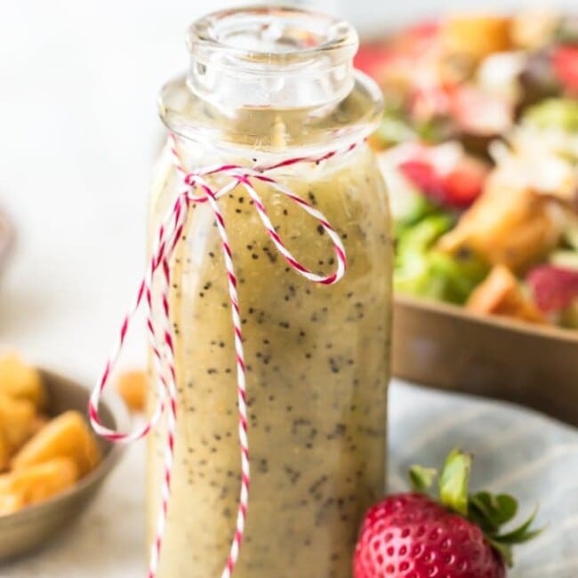 Poppy Seed Dressing is the perfect summer salad dressing. It's light, a little bit sweet, and full of flavor! This homemade poppy seed dressing recipe is super easy to make. It's pairs perfectly with my Strawberry Poppyseed Salad, but it goes well with all kinds of salads. Make some of this poppy seed salad dressing for yourself and dig in to some fresh, tasty salads!