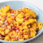 Mango Salsa is a fruity, flavorful spin on traditional salsas. Replacing tomatoes with mango chunks creates something super fresh and fun. This easy mango salsa recipe can be used as a dip with tortillas chips, but it also makes a great topping for tacos, chicken, and more.