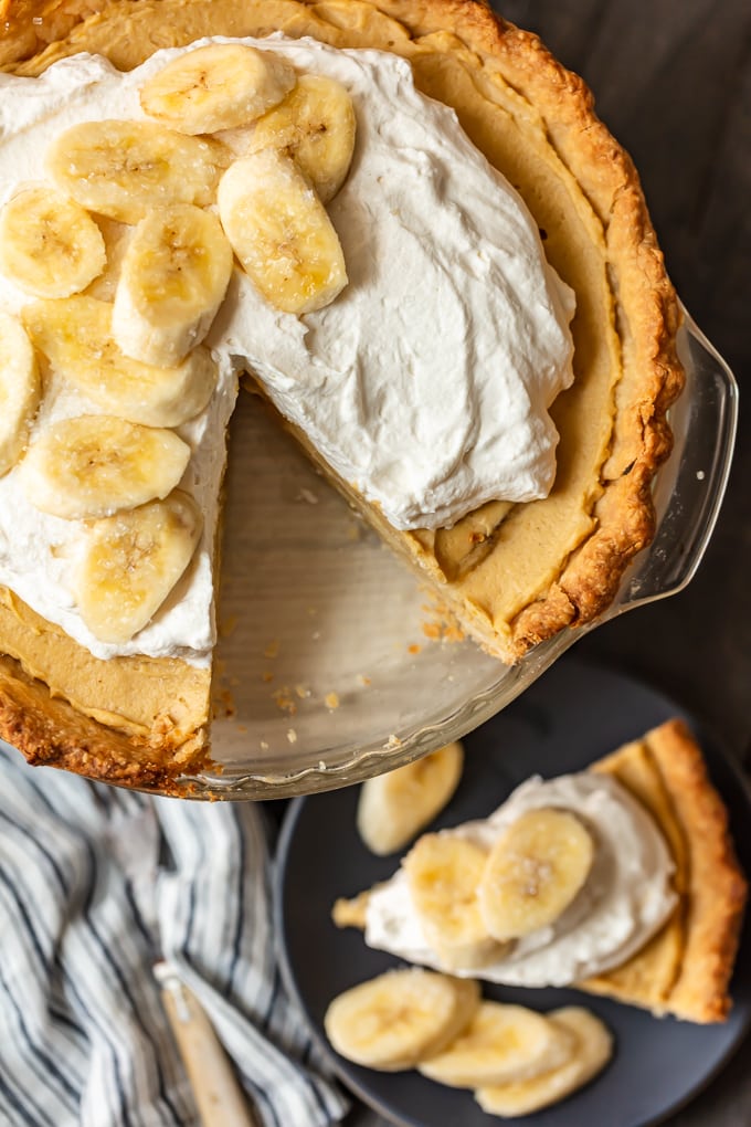 Banana cream pie with a single slice cut out