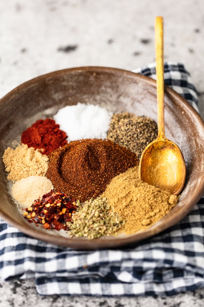 How to make taco seasoning: a bowl of oregano, paprika, chili powder, garlic powder, and other spices