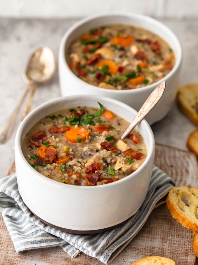 Two bowls of creamy chicken and wild rice soup