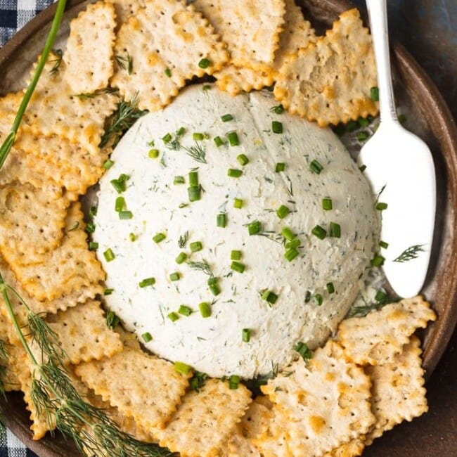 Herb Cream Cheese Dip is a simple yet delicious dip that's perfect for any party or any occasion. Serve it with crackers and guests will devour it! This Herb Coeur a la Creme recipe is savory, tasty, and super easy. There are so many uses for outside of dipping, you will be amazed!