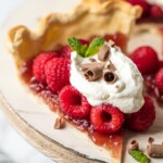 This easy Raspberry Tart recipe is going to change your life! Use this amazing raspberry pie hack to make a simple, delicious, beautiful dessert that you can prepare for guests in no time. It's just as tasty as a traditional pie, but with a lot less hassle. Make this raspberry dessert, or make a version with blueberries, blackberries, or strawberries.