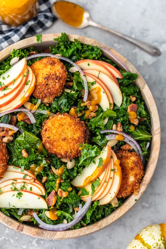 Kale Salad recipe with apples, onions, goat cheese, seeds, and bacon