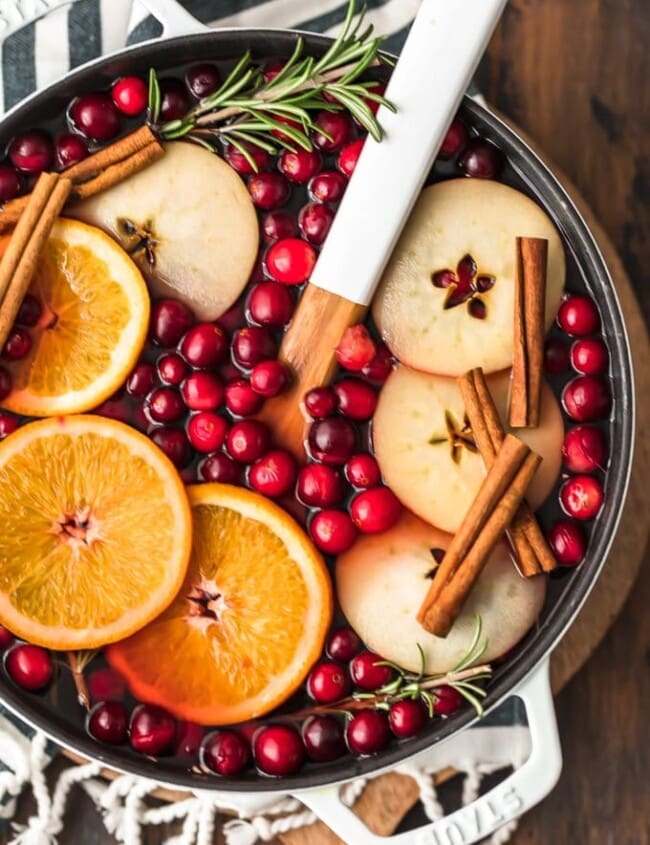 Spiced Cider is a holiday must! Warm things up this season with this delicious Cranberry Apple Hot Cider Recipe. It's easy, it's festive, and it's the perfect drink to serve for any Christmas party. Make it without alcohol for the whole family, or make it spiked hot apple cider for the adults. Either way, the flavor is just perfect!