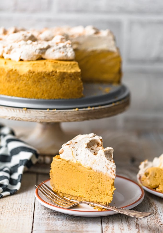 pumpkin cheesecake topped with whipped cream