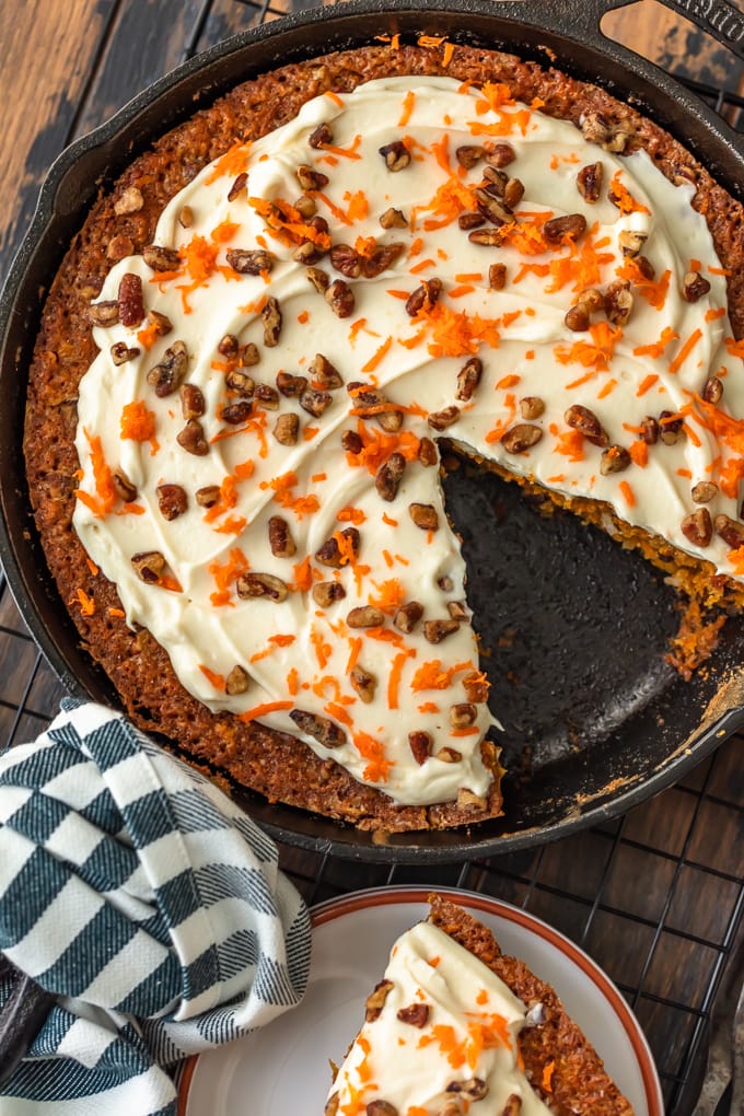 Carrot cake with pineapple in a skillet, with one slice taken out