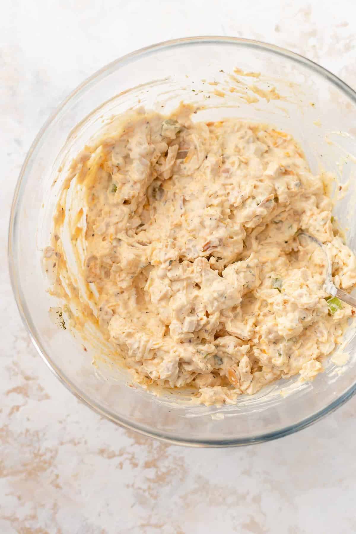 Chicken Salad mixture in a glass bowl.