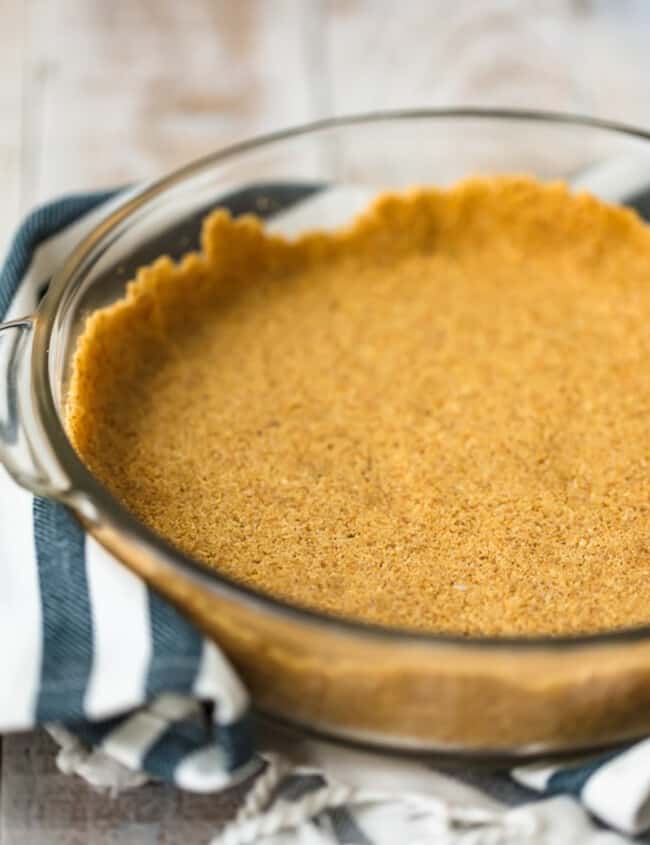 A savory pumpkin pie in a glass dish on a table.