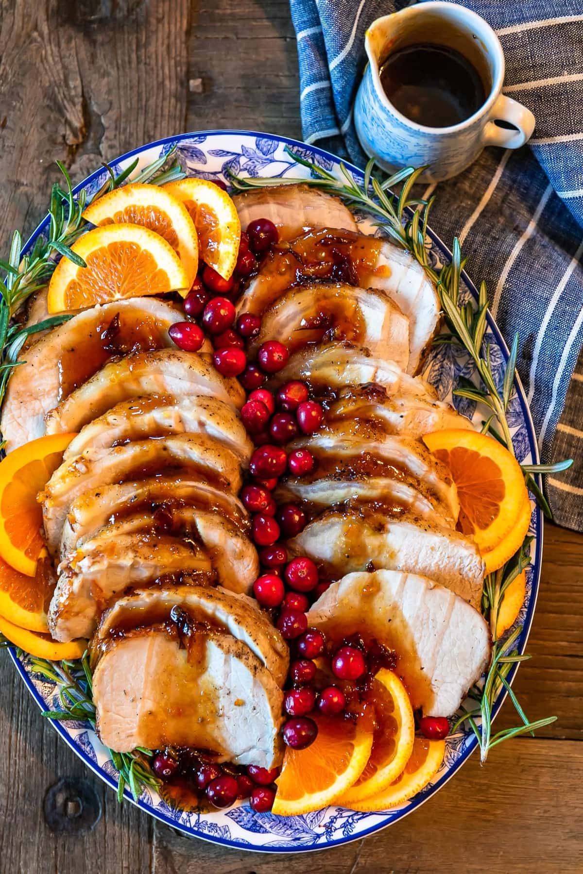 orange cranberry pork loin roast on a serving platter