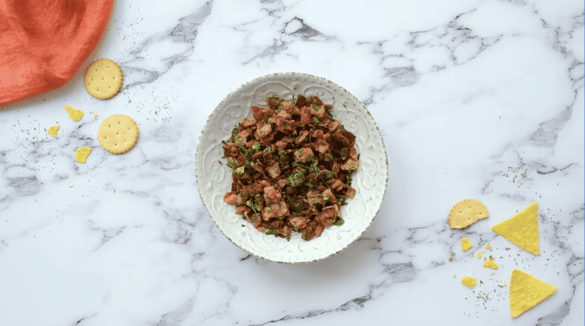 bacon and parsley in a white bowl.