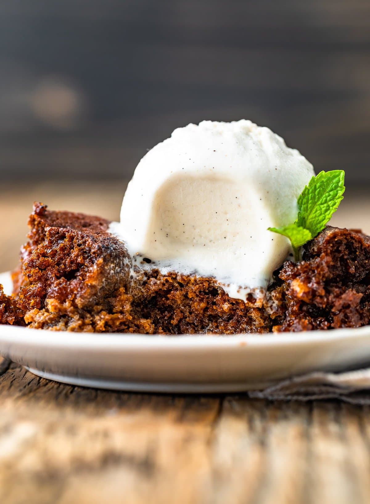 close up view of ice cream melting into the gingerbread pudding cake