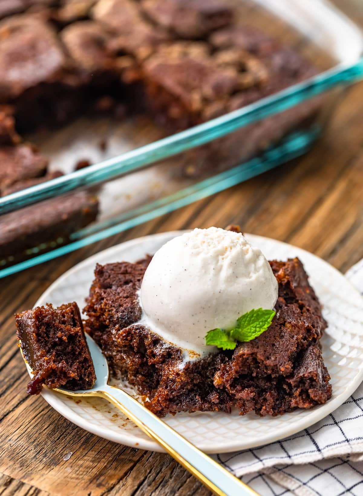 gingerbread pudding cake and ice cream with a spoon