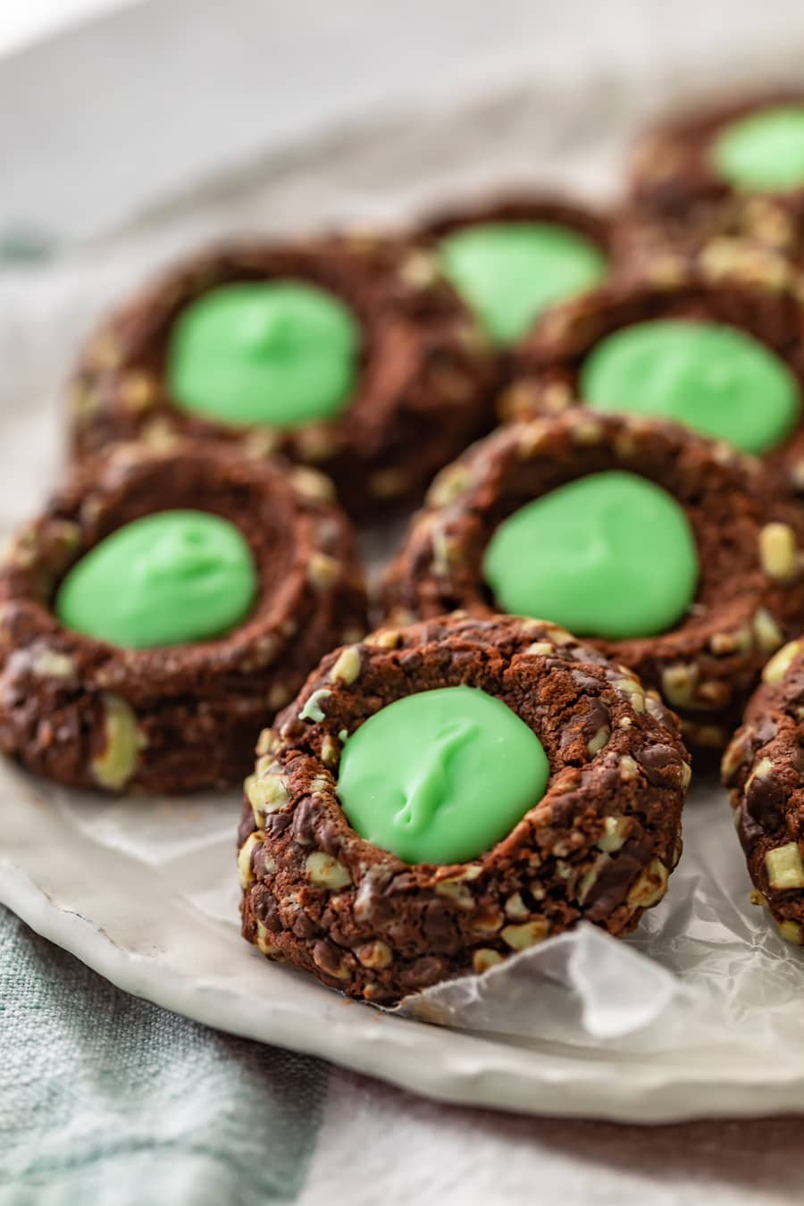 a plate of mint chocolate thumbprint cookies