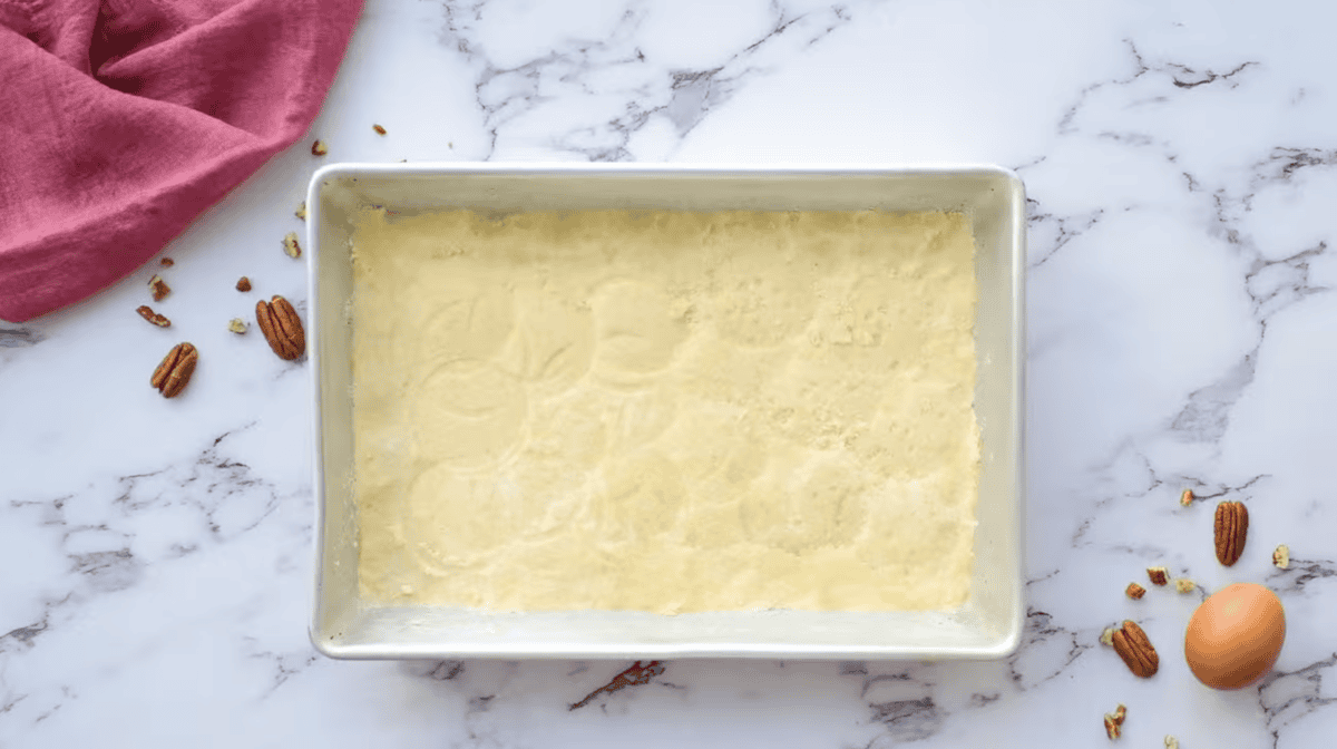 pie dough pressed into a baking pan.