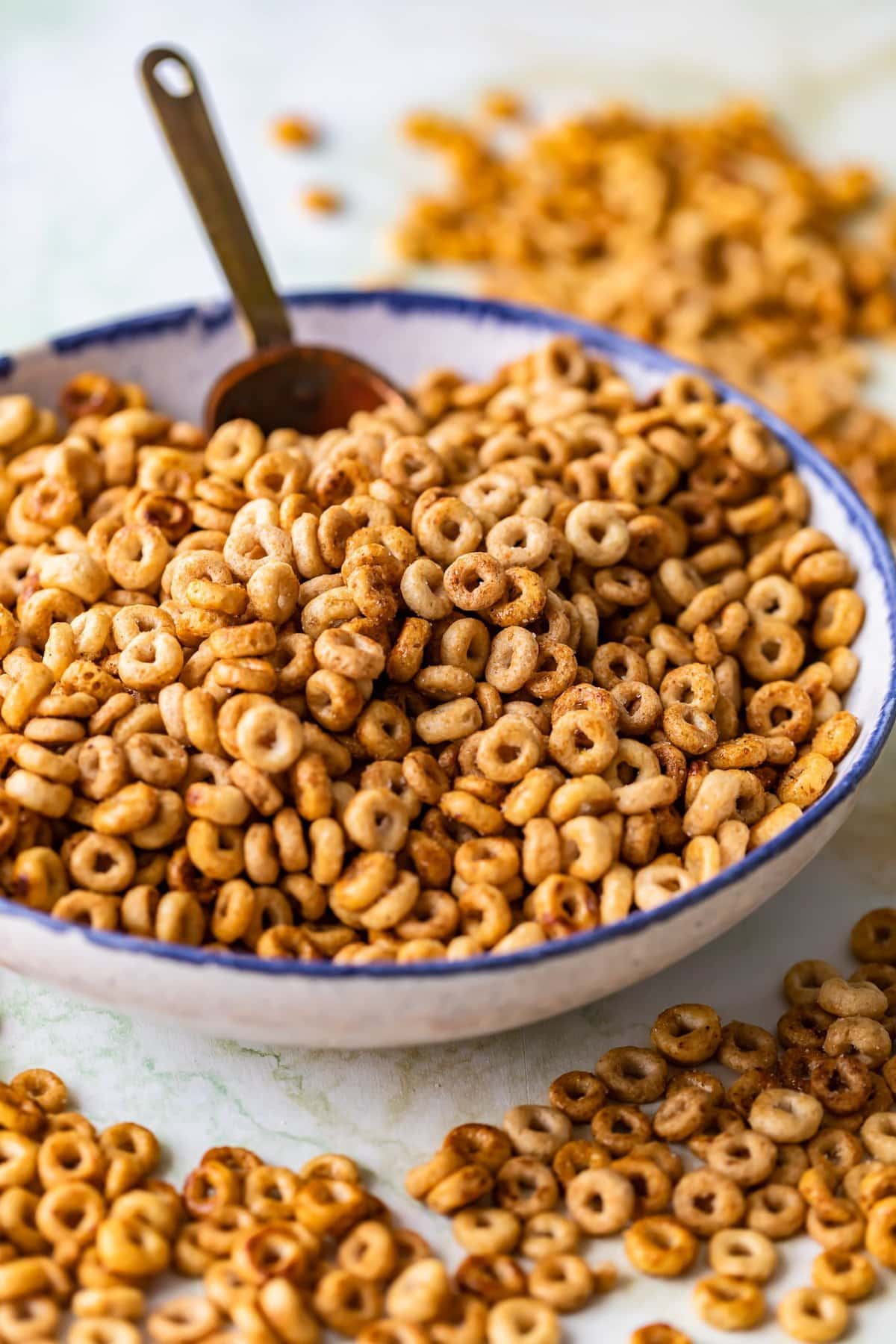 a bowl of sweet and salty cheerios with a scoop