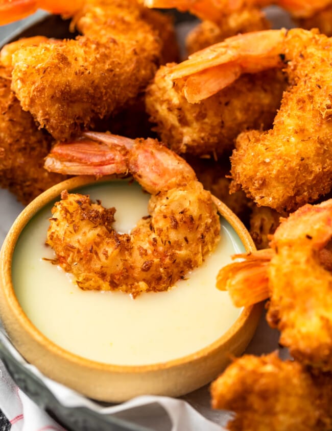 Coconut Shrimp is a crispy, crave-worthy appetizer that everyone will love. It's especially delicious when paired with the perfect coconut shrimp sauce: a Spicy Pina Colada Dipping Sauce! The two go hand in hand, a match made in heaven. And this coconut shrimp recipe is just as good as a main dish as it is as a party appetizer!