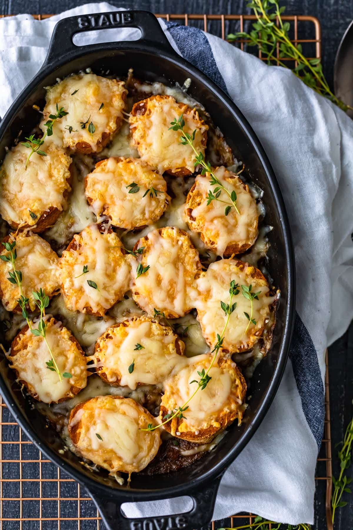 overhead view of a black casserole dish filled with french onion casserole