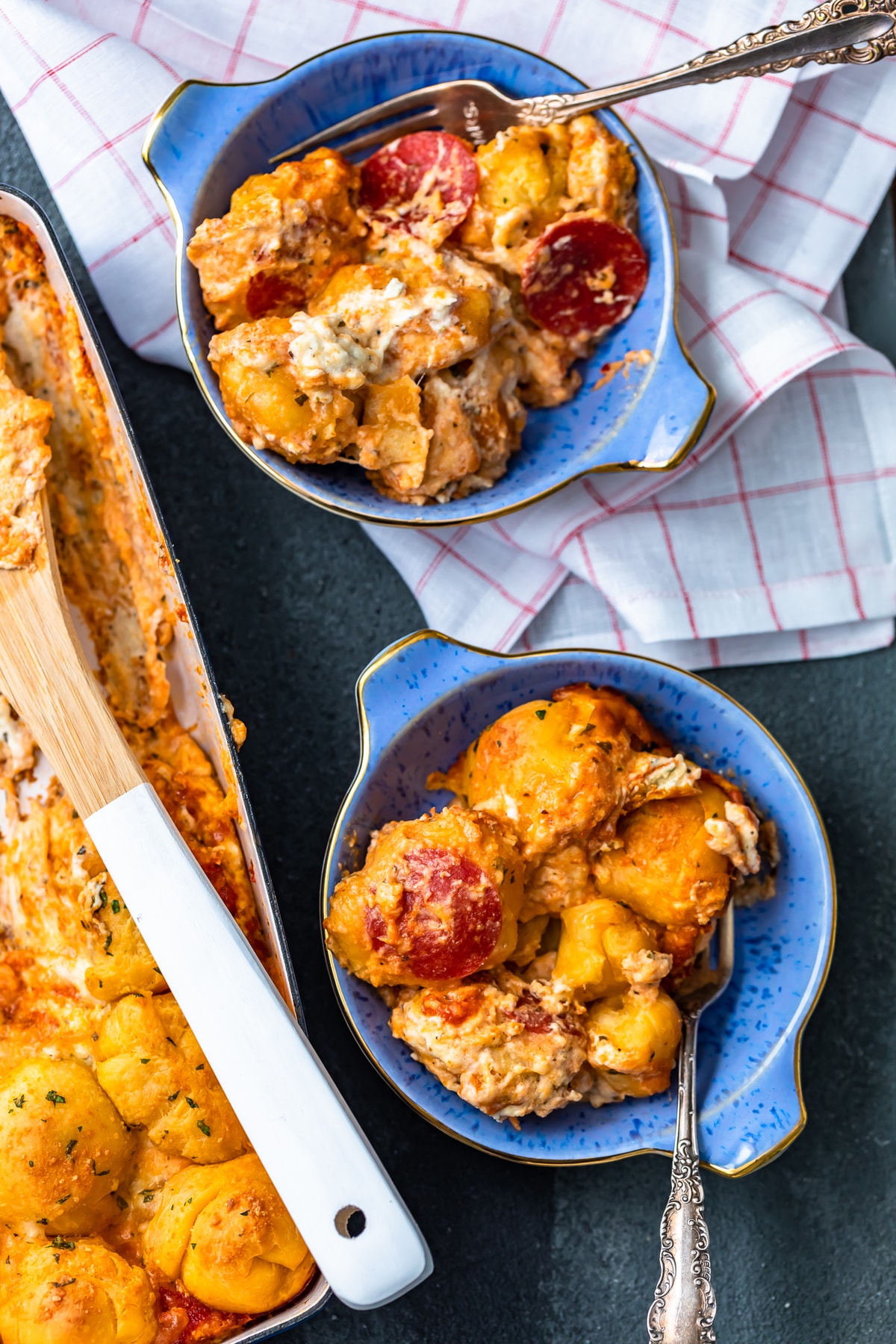 two bowls filled with pizza casserole