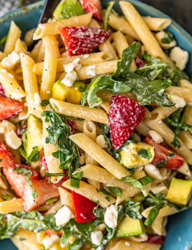 Strawberry Avocado Pasta Salad is an easy and tasty summer pasta salad recipe that everyone will love! This penne pasta salad with feta, strawberries, avocado, poppy seed dressing and more is so light and fresh. Serve it warm or serve it cold, either way, it's sure to be a hit!