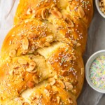 This Easter Bread recipe is so fun and festive! This simple sweet bread recipe is filled with flavor, and topped with sprinkles for a special treat. The Orange Almond flavor is perfect for Easter Sunday!