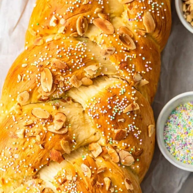 This Easter Bread recipe is so fun and festive! This simple sweet bread recipe is filled with flavor, and topped with sprinkles for a special treat. The Orange Almond flavor is perfect for Easter Sunday!