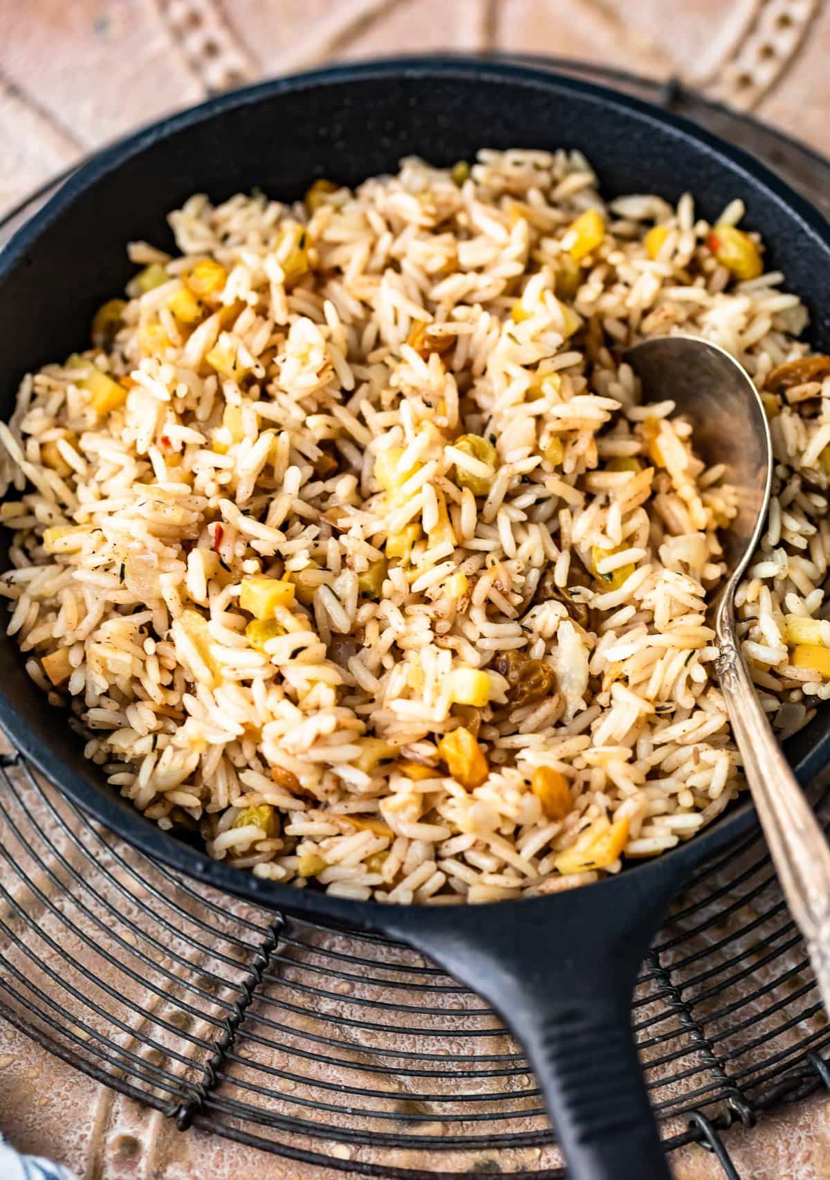 A bowl of food with rice meat and vegetables, with Pilaf 